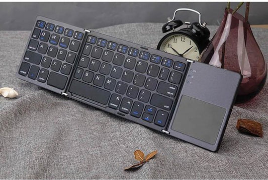 Opvouwbaar Bluetooth Toetsenbord met Touchpad – Ultradun Foldable Keyboard – Bluetooth 3.0 Technologie – Universeel – Voor Windows, Android, iOS & MacOS – QWERTY Toetsenbord - Compact